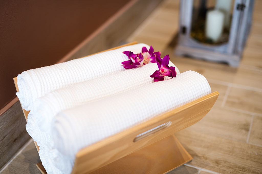 Wellness massage salon Chicago towels decorated with flowers